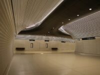 An empty room with white walls and a ceiling